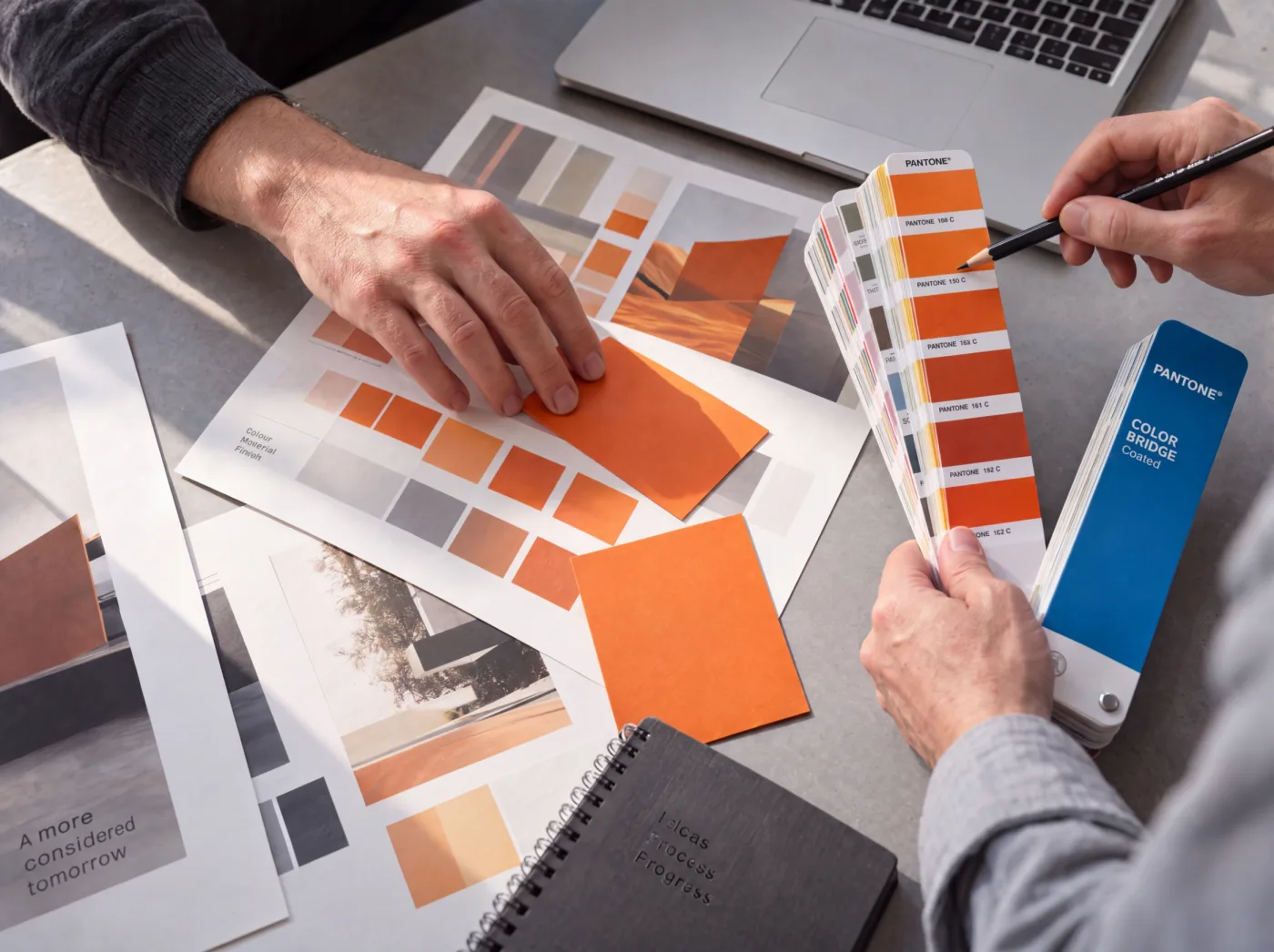 Colour swatches and print proofs on a desk